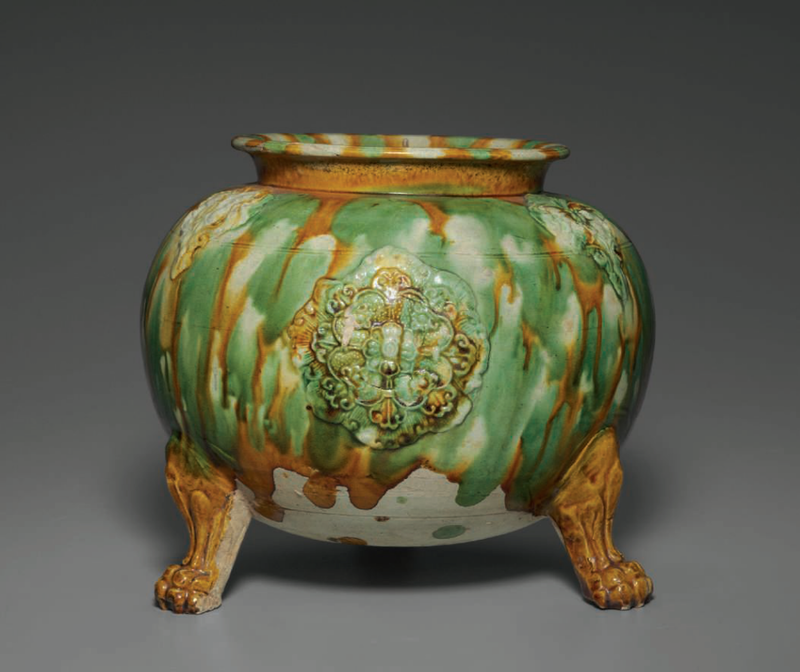A sancai-glazed applique-decorated tripod jar, Tang dynasty (AD 618-907)