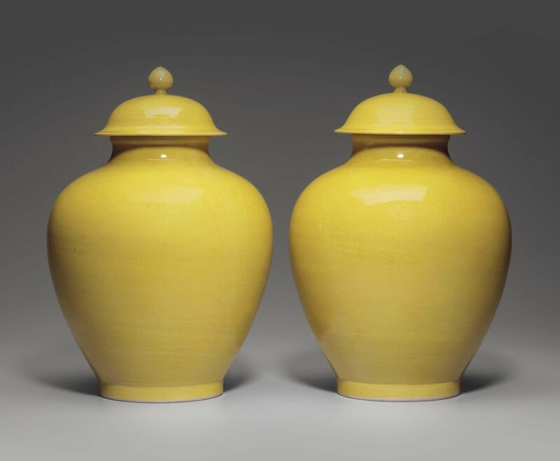 A pair of yellow-glazed jars and covers, Daoguang six-character incised seal marks and of the period (1821-1850)