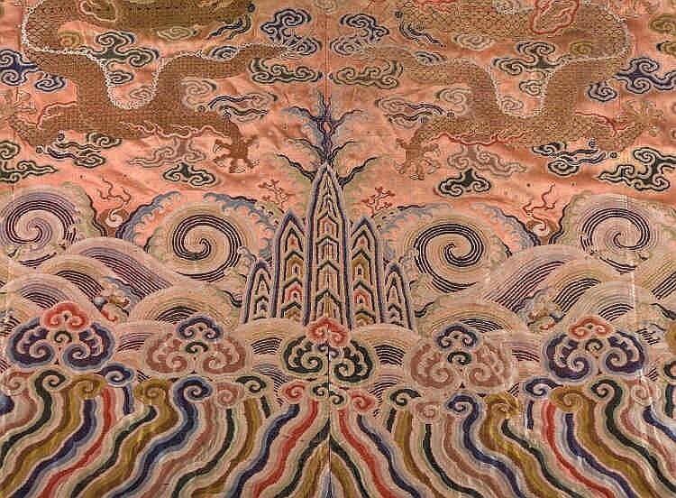 A coral ground silk Tibetan chuba, tailored from 18th century Chinese kesi4