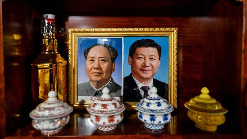 Xi-Jinping-R-and-Mao-Zedong-L-placed-at-an-altar-in-a-hotel-in-TAR-Photo-AFP