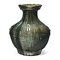 A <b>dark</b> <b>green</b>-<b>glazed</b> red pottery jar, hu, China, Han dynasty (206 BC-AD 220)