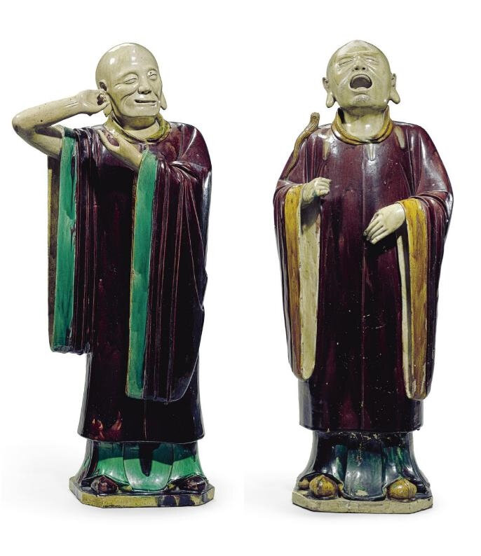 A large pair of glazed stoneware luohan, Ming dynasty (1368-1644)