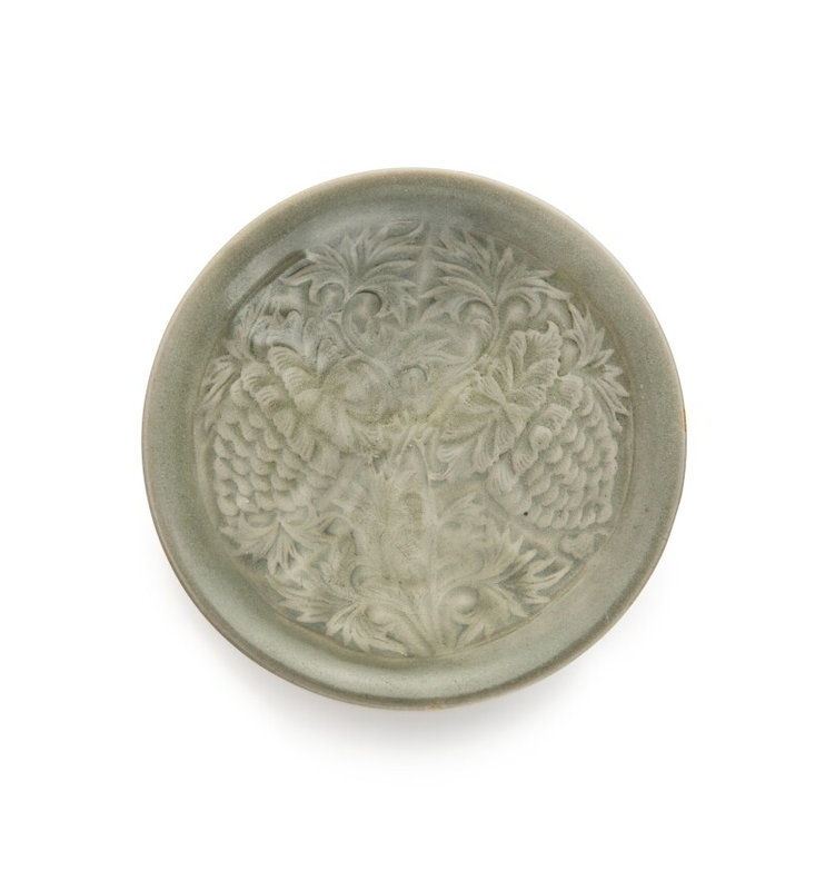 A molded 'Yaozhou' celadon-glazed 'floral' bowl, Northern Song-Jin dynasty (960-1234)