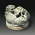 A Yaozhou celadon <b>censer</b> <b>cover</b> in the form of two entwined lions, China, Northern Song-Jin Dynasty, 12th-13th century
