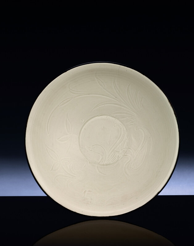 A rare finely carved Dingyao 'ducks' bowl, Northern Song Dynasty (960-1127)