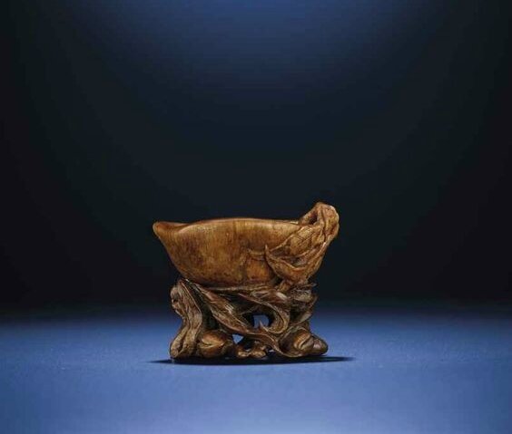 A finely carved peach-form rhinoceros horn libation cup, Late Ming-Early Qing dynasty, 17th century 