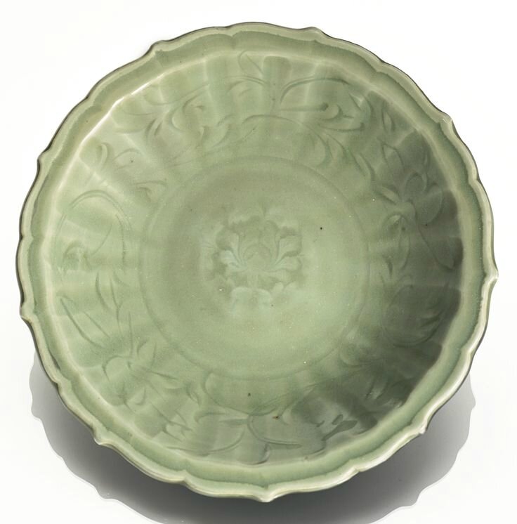 A 'Longquan' celadon barbed-rim 'Lotus' dish, Early Ming dynasty