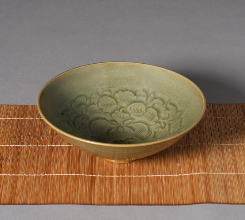 A finely carved Yaozhou celadon ''floral' bowl, Song Dynasty (960-1279)