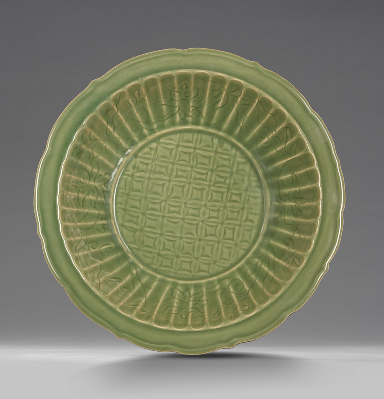 A large Longquan celadon-glazed carved 'floral' dish, Ming Dynasty (1368-1644)