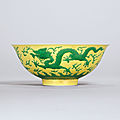 A rare yellow-ground <b>green</b>-<b>enamelled</b> ‘dragon’ bowl, Yongzheng six-character mark and of the period (1723-1735)