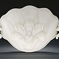 A highly important Mughal white jade shell-formed cup, 17th century, inscribed with a Qianlong imperial poem dated to <b>1774</b>