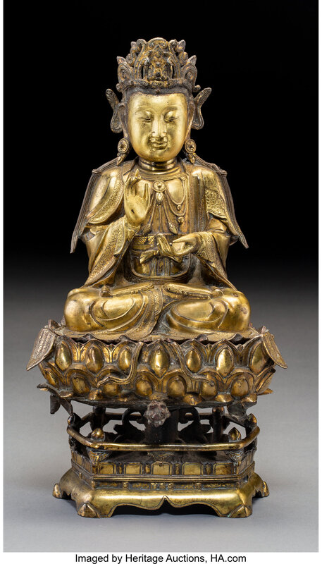 A Chinese Gilt Bronze Guanyin Figure on Stand, late Ming Dynasty