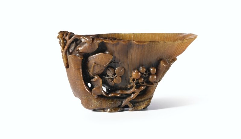 A Carved Rhinoceros Horn 'Plantain' Cup by You Kan, Qing Dynasty, Kangxi Period (1662-1722)