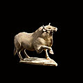 A finely modelled painted pottery figure of an ox, <b>Northern</b> <b>Wei</b> <b>dynasty</b> (<b>386</b>-<b>534</b>)