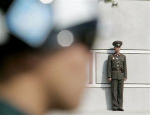 2351189028_north_right_and_south_korean_soldiers_stand_guard_at_the