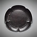 A large <b>brown</b> <b>lacquer</b> dish in the form of a prunus blossom, Northern Song Dynasty, 10th-11th century