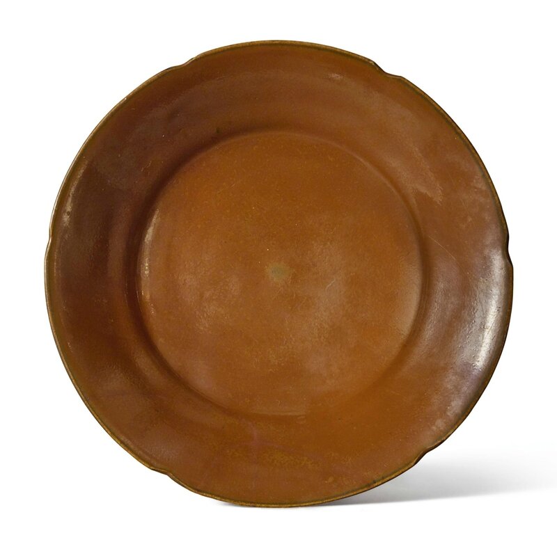 A rare persimmon-glazed 'Ding'-type mallow-form dish, Northern Song dynasty (960–1127)