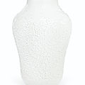 A  molded creamy-white-glazed baluster vase, 18th century