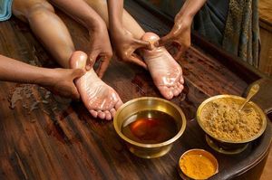 2958841-227055-indian-doctors-doing-traditional-ayurvedic-oil-foot-massage