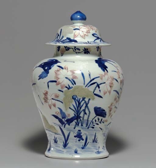 A_copper_red__c_ladon_and_slip_decorated_blue_and_white_baluster_jar_and_cover__Kangxi_period__1662_1722_