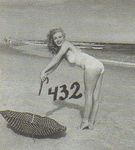 1949_tobey_beach_by_dedienes_umbrella_red_062_2