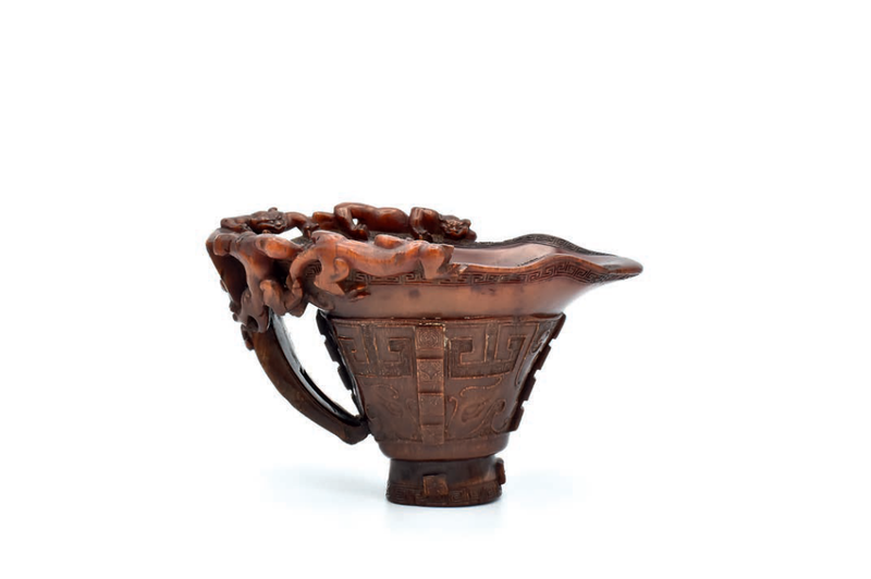 A rare Chinese rhinoceros horn archaistic libation cup, Qing dynasty, 17th century