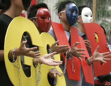 Masked_protesters_rally_in_front_of_the_World_Bank_office_in_the_Philippines_to_protest_the_G_8__in_Italy_Wednesday_July_8_2009