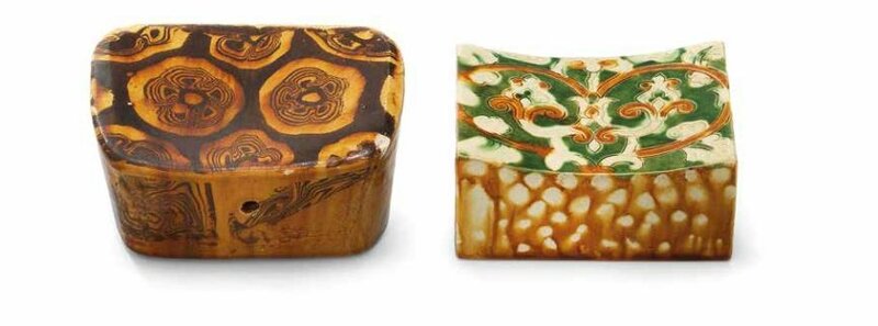 An incised sancai pillow and an amber-glazed marbled pillow, Tang dynasty (618-907)