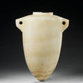 An Egyptian <b>alabaster</b> torpedo vase. Third Intermediate Period, 22nd-23rd Dynasty, circa 9th-8th Century B.C.