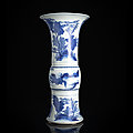 A '<b>Gu</b>'-shaped blue and white porcelain vase with figures and animals, Kangxi period (1662-1722)