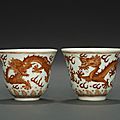 Two iron red '<b>dragon</b>' <b>wine</b> <b>cups</b>, Guangxu six-character marks and of the period