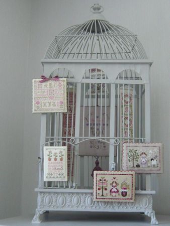 Point de croix presenter ses ouvrages cage à oiseaux