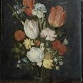 Workshop of Jan Brueghel the Younger, Parrot tulips, irises, carnations and other flowers in a glass beaker on a wooden table...