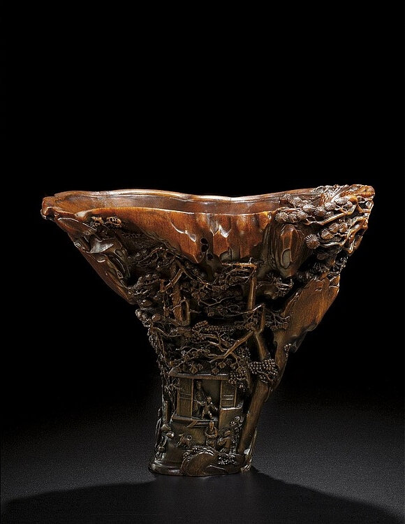 A rare and exceptionally carved rhinoceros horn libation cup, by Bao Tiancheng, 17th century