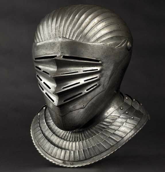 A South German Maximilian style close helmet for a fluted suit of armour, circa 1530
