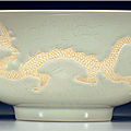 A rare biscuit-decorated white-glazed 'dragon' bowl, <b>Hongzhi</b> <b>six</b>-<b>character</b> <b>mark</b> <b>and</b> <b>of</b> <b>the</b> <b>period</b> (1488-1505)