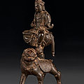 A bronze figure of Wenshu seated on a lion, <b>Northern</b> <b>Song</b> <b>dynasty</b> (AD 960-1127)