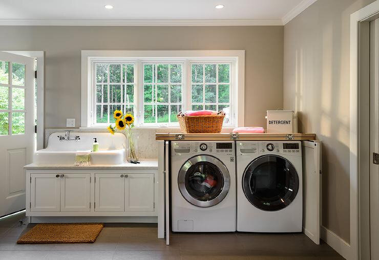 hiden-washer-dryer-in-cabinet-with-folding-doors