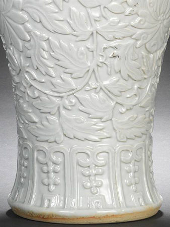 A_rare_white_glazed_relief_decorated_vase_and_cover4