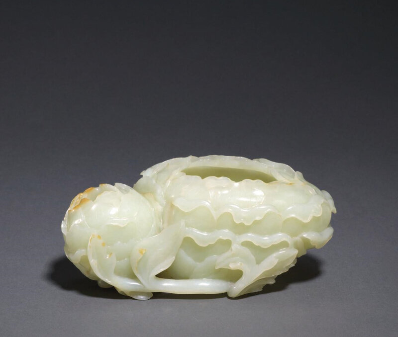 A large finely-carved pale greenish-white and russet jade 'Double peony ...