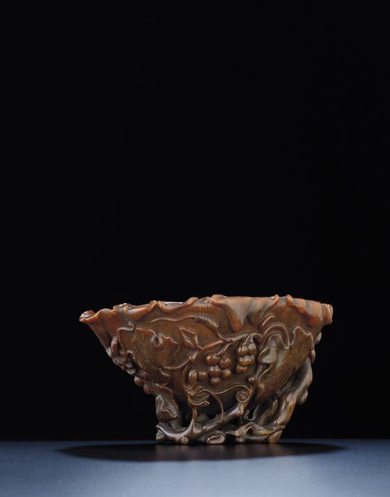 A large rhinoceros horn 'grape vine' libation cup, Qing dynasty, late 17th-18th century
