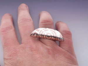 Silver_inlaid_copper_ring_on_hand