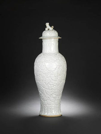 A_rare_white_glazed_relief_decorated_vase_and_cover1