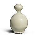 A rare white-glazed double-<b>gourd</b> vase, Tang dynasty (618-907)