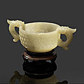 A pale green jade double-handed cup, Ming Dynasty (<b>1368</b>-<b>1644</b>)