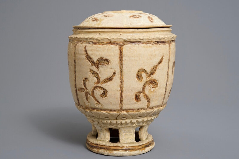 A Vietnamese jar and cover on reticulated stand, Trần dynasty, 13th-15th century