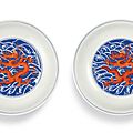 A pair of <b>blue</b> <b>and</b> <b>white</b> <b>and</b> <b>iron</b>-<b>red</b> 'dragon' dishes, seal marks <b>and</b> period of Qianlong
