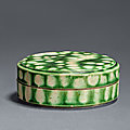 A green-glazed applique-decorated box and cover, Tang dynasty, 7th-<b>10th</b> <b>century</b>