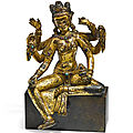 A rare gilt-copper figure of Vasudhara, Nepal, <b>14th</b> –<b>15th</b> <b>century</b>