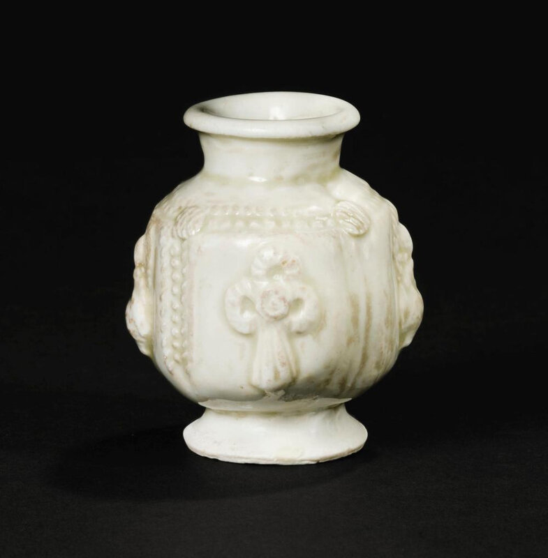 A small white-glazed 'Buddha' lantern vase, Five Dynasties, 10th century